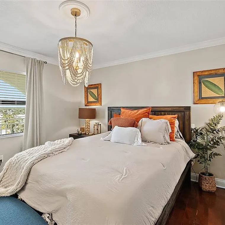 Guest bedroom with coastal furnishings in the Ormond Beach oceanfront penthouse