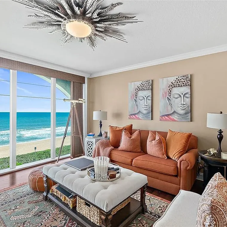 Living room with floor-to-ceiling Atlantic Ocean views in the Ormond Beach oceanfront penthouse