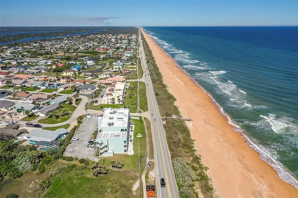 Aerial view of the car-free no-drive beach and Atlantic coastline at Ormond-by-the-Sea, Florida, with no vehicles on the sand